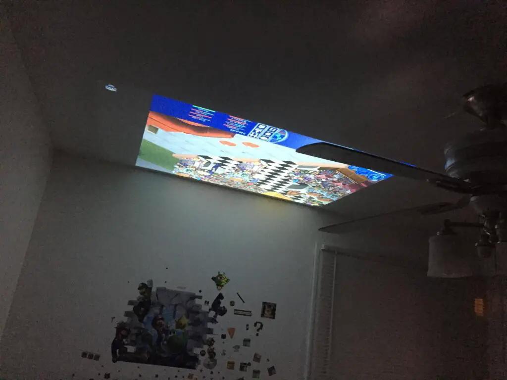Projector On Ceiling Above Bed
